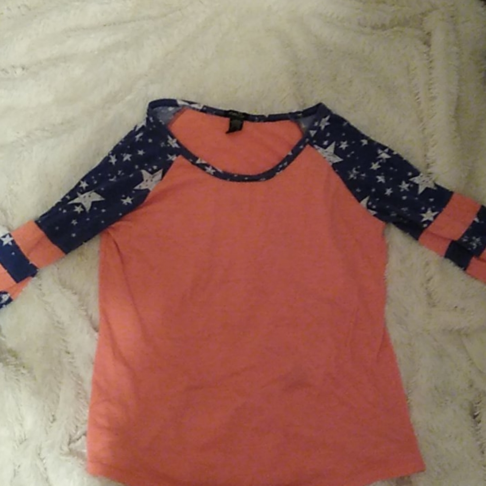 Peach an navy shirt with stared and striped sleeve